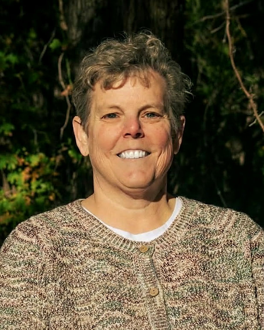 Jennifer D. Ashford, business consultant and virtual executive assistant, smiling outdoors.